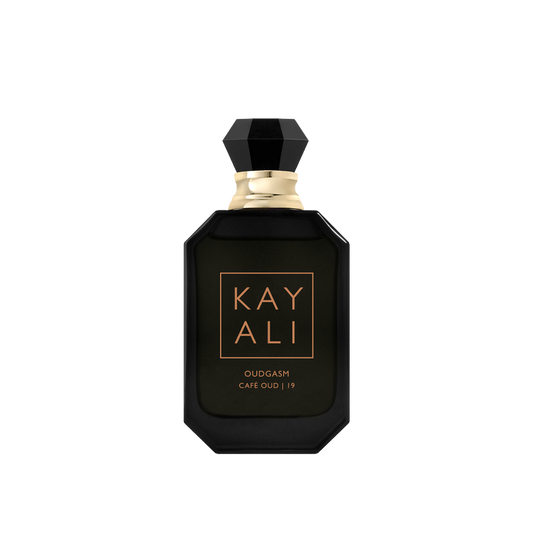 Black perfume bottle with gold accents on a white background