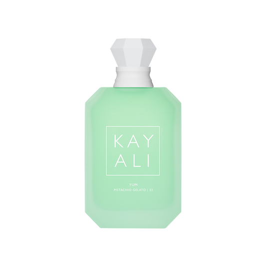 Green perfume bottle with white cap on a white background